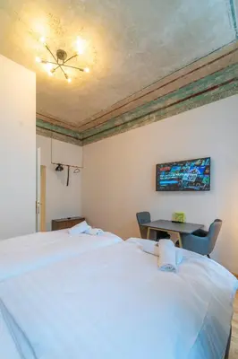 Ein Bett oder Betten in einem Zimmer der Unterkunft josef's home I Renaissance Studio