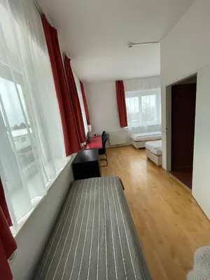 Ein Bett oder Betten in einem Zimmer der Unterkunft Workbase Hostel