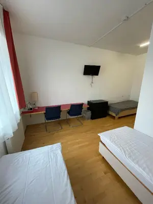 Ein Bett oder Betten in einem Zimmer der Unterkunft Workbase Hostel