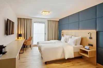 Ein Bett oder Betten in einem Zimmer der Unterkunft Austria Trend Hotel Maximilian