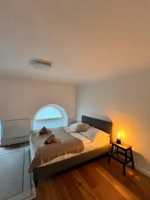 Ein Bett oder Betten in einem Zimmer der Unterkunft REMA Apartments 1090