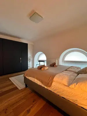 Ein Bett oder Betten in einem Zimmer der Unterkunft REMA Apartments 1090