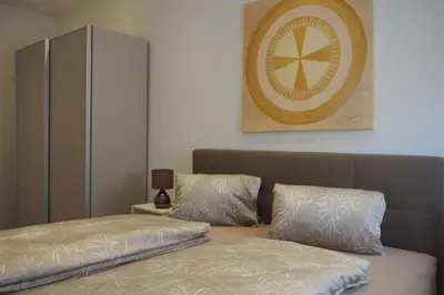 Ein Bett oder Betten in einem Zimmer der Unterkunft Weghuberhof Ferienwohnungen