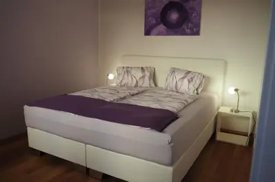 Ein Bett oder Betten in einem Zimmer der Unterkunft Weghuberhof Ferienwohnungen