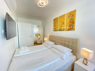 Ein Bett oder Betten in einem Zimmer der Unterkunft Steiner Residences Vienna Nestroyplatz