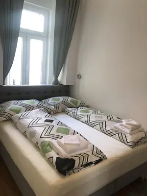 Ein Bett oder Betten in einem Zimmer der Unterkunft PULSE OF VIENNA by JR City Apartments