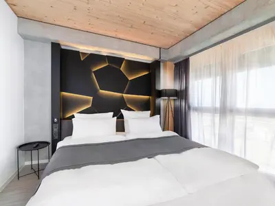 Ein Bett oder Betten in einem Zimmer der Unterkunft DORMERO HoHo Wien