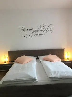 Ein Bett oder Betten in einem Zimmer der Unterkunft Pension Seeblick Latzko