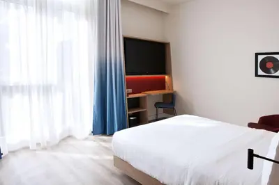 Ein Bett oder Betten in einem Zimmer der Unterkunft Hampton By Hilton Vienna Messe