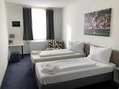 Ein Bett oder Betten in einem Zimmer der Unterkunft Pension Tennisweber