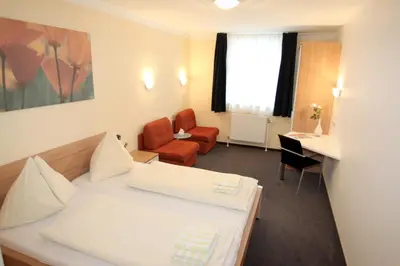 Ein Bett oder Betten in einem Zimmer der Unterkunft Pension Tennisweber
