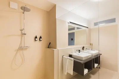 Ein Badezimmer in der Unterkunft URBAN ISLAND I Riverside Apartments
