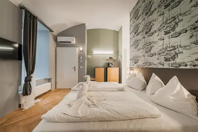 Ein Bett oder Betten in einem Zimmer der Unterkunft easy-flat Neustiftgasse - AC Studio Apartments near MuseumsQuartier