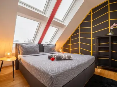 Ein Bett oder Betten in einem Zimmer der Unterkunft Modern Suite Naschmarkt