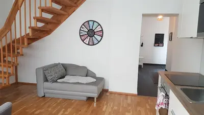 Ein Sitzbereich in der Unterkunft Moderne Maisonette mit Terrasse