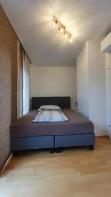Ein Bett oder Betten in einem Zimmer der Unterkunft Wiener Maisonette mit Terrasse