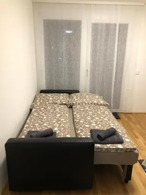 Ein Bett oder Betten in einem Zimmer der Unterkunft Neubau Wohnung Stadlau