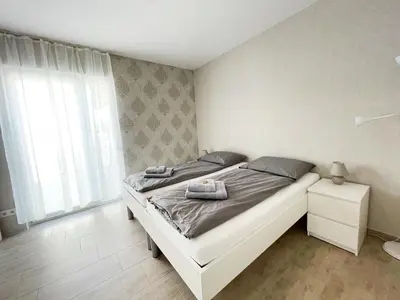 Ein Bett oder Betten in einem Zimmer der Unterkunft Pension Voesendorf