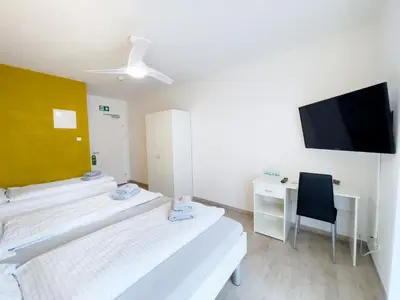Ein Bett oder Betten in einem Zimmer der Unterkunft Pension Voesendorf