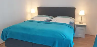 Ein Bett oder Betten in einem Zimmer der Unterkunft Exquisit Apartment Simmering