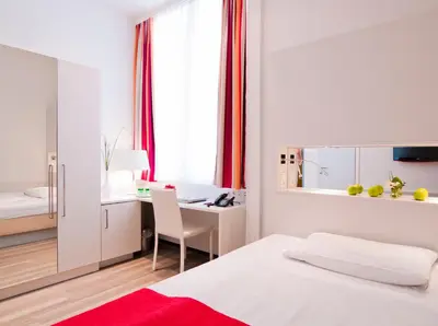 Ein Bett oder Betten in einem Zimmer der Unterkunft Hotel Zipser