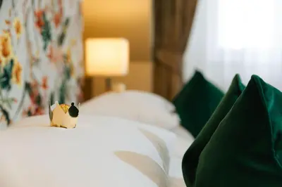 Ein Bett oder Betten in einem Zimmer der Unterkunft Hotel Kaiserhof Wien