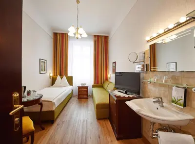 Ein Bett oder Betten in einem Zimmer der Unterkunft Hotel Austria - Wien