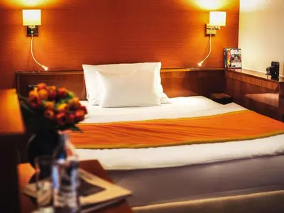Ein Bett oder Betten in einem Zimmer der Unterkunft Mercure Grand Hotel Biedermeier Wien
