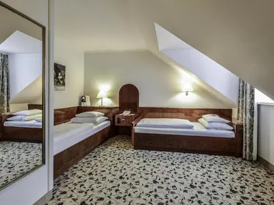 Ein Bett oder Betten in einem Zimmer der Unterkunft Mercure Grand Hotel Biedermeier Wien
