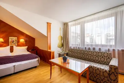 Ein Bett oder Betten in einem Zimmer der Unterkunft Hotel Am Schubertring