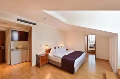 Ein Bett oder Betten in einem Zimmer der Unterkunft Hotel Am Schubertring