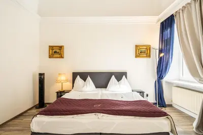 Ein Bett oder Betten in einem Zimmer der Unterkunft Hotel Am Schubertring