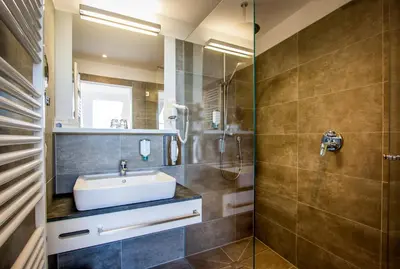 Ein Badezimmer in der Unterkunft BoutiqueHOTEL Donauwalzer