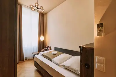 Ein Bett oder Betten in einem Zimmer der Unterkunft Urban Rooms Rathaus - Self Check-In