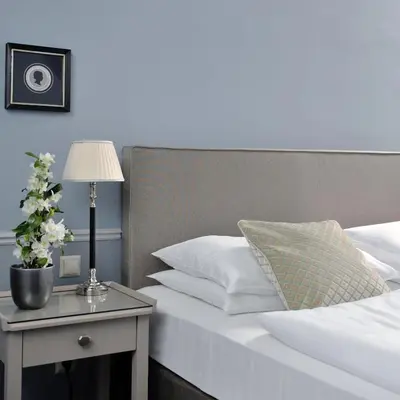 Ein Bett oder Betten in einem Zimmer der Unterkunft Hotel Kärntnerhof