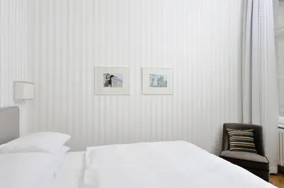 Ein Bett oder Betten in einem Zimmer der Unterkunft Hotel Kärntnerhof