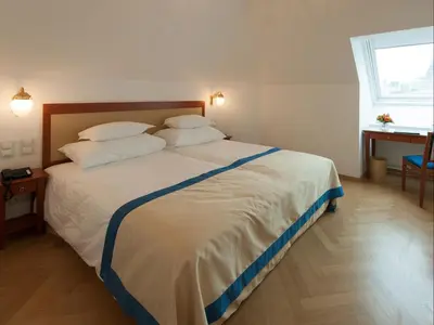 Ein Bett oder Betten in einem Zimmer der Unterkunft Hotel Ambassador
