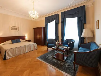 Ein Bett oder Betten in einem Zimmer der Unterkunft Hotel Ambassador