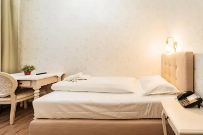 Ein Bett oder Betten in einem Zimmer der Unterkunft Hotel Pension Baronesse