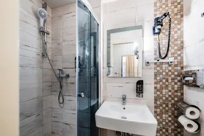 Ein Badezimmer in der Unterkunft Hotel Pension Baronesse