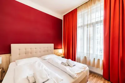 Ein Bett oder Betten in einem Zimmer der Unterkunft Hotel Pension Baronesse