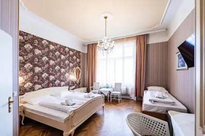 Ein Bett oder Betten in einem Zimmer der Unterkunft Hotel Pension Baronesse
