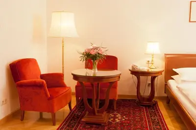 Ein Bett oder Betten in einem Zimmer der Unterkunft Hotel Kaiserin Elisabeth
