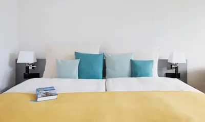 Ein Bett oder Betten in einem Zimmer der Unterkunft Living Hotel Kaiser Franz Joseph