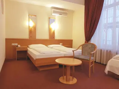 Ein Bett oder Betten in einem Zimmer der Unterkunft Hotel Haydn