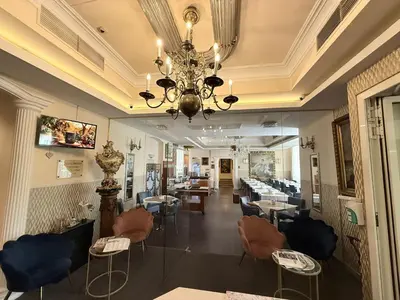Ein Sitzbereich in der Unterkunft Hotel Pension Excellence