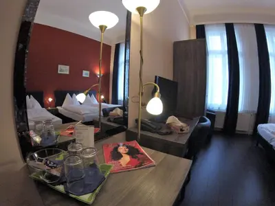 Ein Bett oder Betten in einem Zimmer der Unterkunft Hotel Pension Excellence