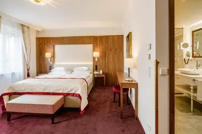 Ein Bett oder Betten in einem Zimmer der Unterkunft Hotel Stefanie - VIENNA'S OLDEST HOTEL