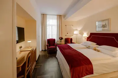 Ein Bett oder Betten in einem Zimmer der Unterkunft Hotel Erzherzog Rainer