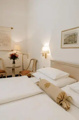 Ein Bett oder Betten in einem Zimmer der Unterkunft Hotel Erzherzog Rainer